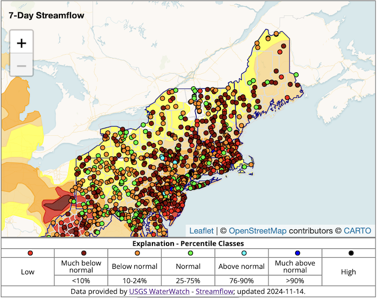 Orange, burgundy and red dots indicate below and much below normal streamflows are dominant in New York and New England.