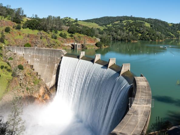 Water spills over the top of Englebright Dam on the Yuba River. Photo credit: Gary Saxe/Shutterstock.