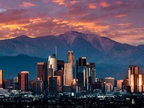 City in front of mountains.