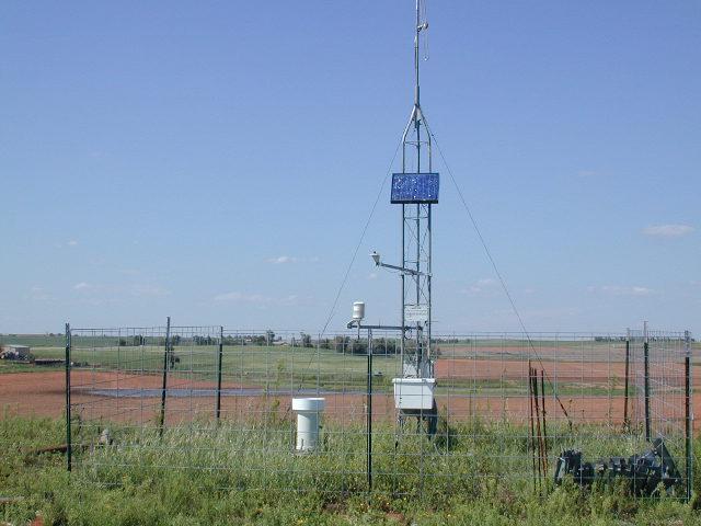 ARS Micronet Tower in a field. Photo credit: Dr. Christopher A. Fiebrich, Oklahoma Climatological Survey.