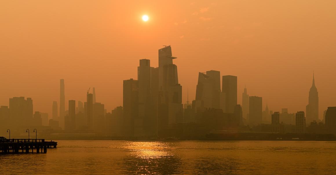 Sunrise over NYC during Canadian Wildfire Smoke Event, from Hoboken, NJ. Image credit: Brian Youchak, Shutterstock,.