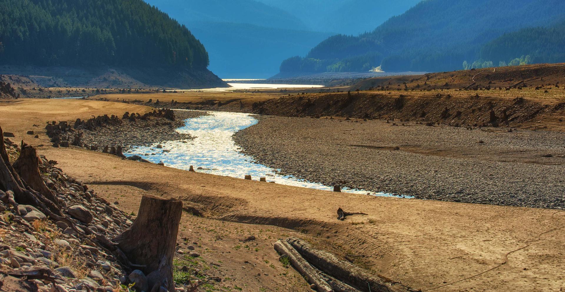 Low water levels in a lake due to drought conditions