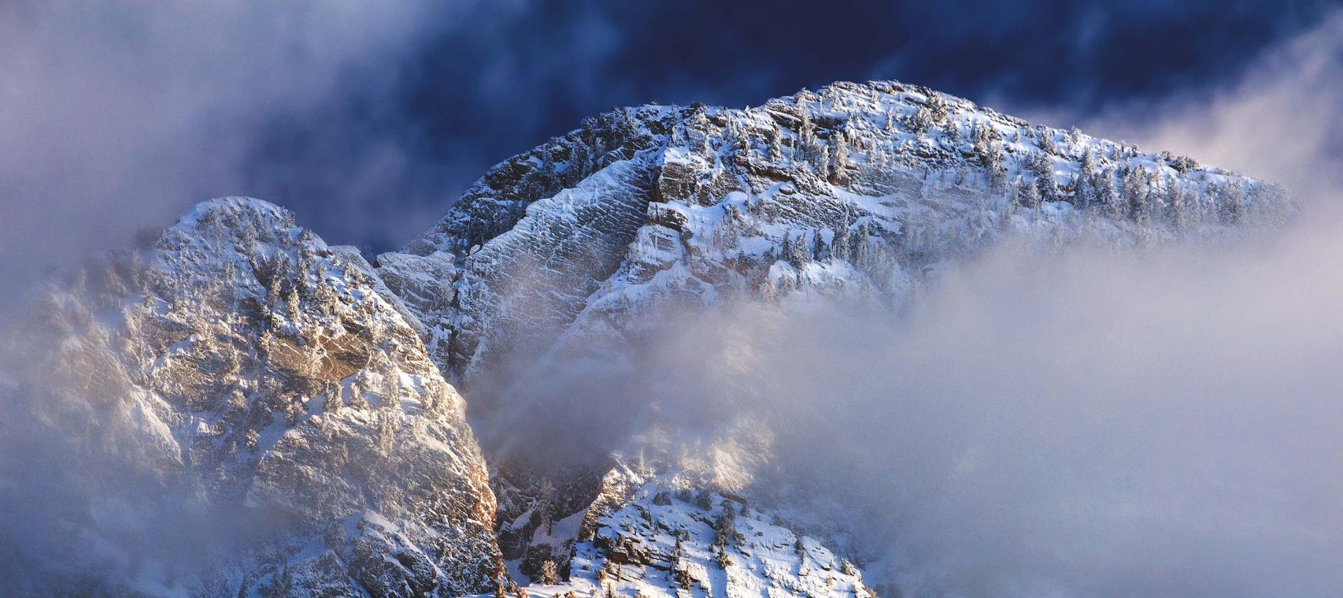 Winter snow and fog cling to Mount Timpanogos in the Wasatch Front mountains 