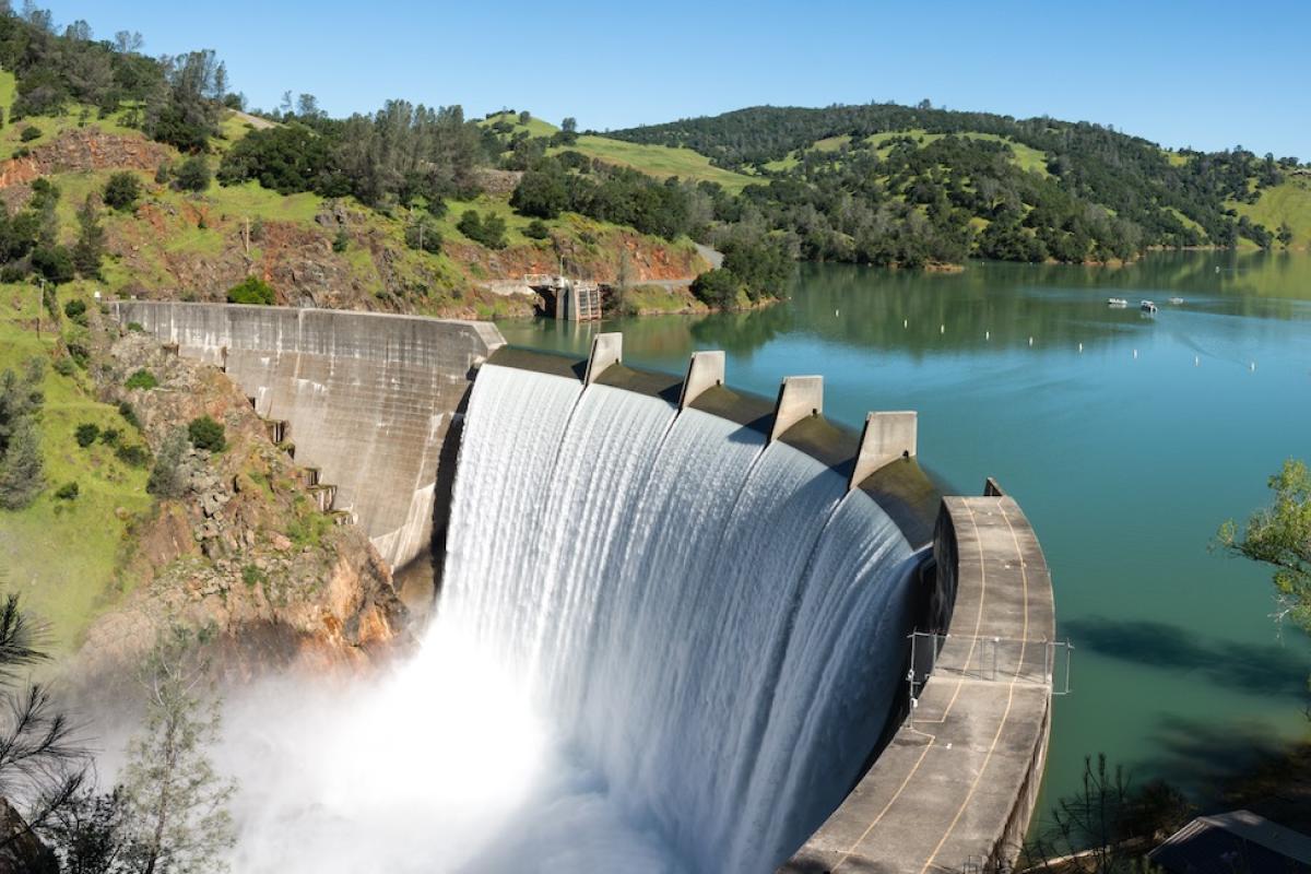 Water spills over the top of Englebright Dam on the Yuba River. Photo credit: Gary Saxe/Shutterstock.